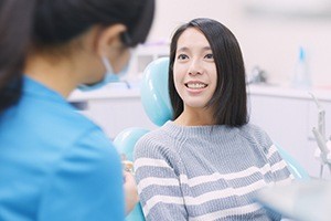 Woman discussing the smile design process with her cosmetic dentist