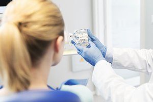 Patient discussing T M J treatment with dentist
