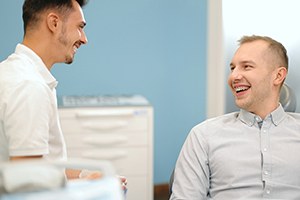 Happy patient interaction with dental team member