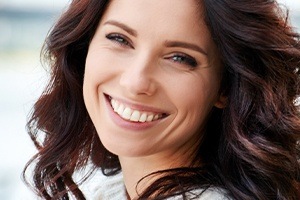 Woman showing beautiful smile after gum recontouring