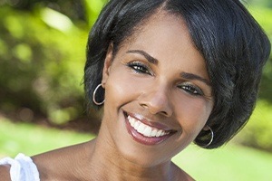 Woman with flawless smile after smile makeover
