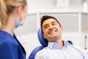 Happy male patient at appointment for dental bonding