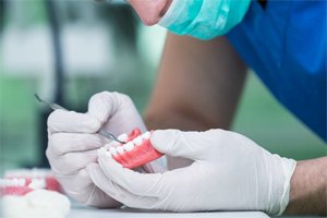 Dental lab technician working to create dentures in Belmont