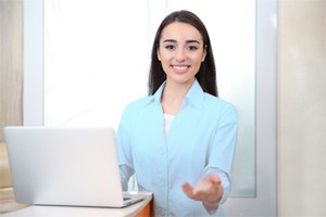 Dental team member, ready to accept payment for dentures