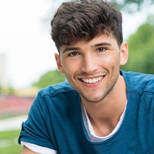 Young man smiling after emergency dentistry