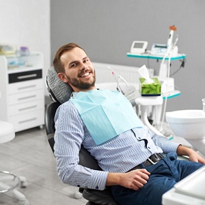 Patient smiling after dental implant failure and salvage in Belmont