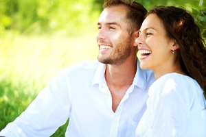 Attractive couple enjoying the benefits of gum recontouring and crown lengthening