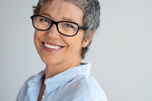 Older woman enjoying long-term benefits of dental implants
