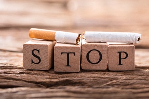 Close-up of broken cigarette on top of wooden blocks