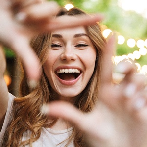 Woman’s beautiful smile with metal free restorations in Belmont