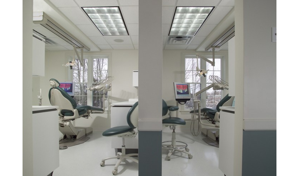 Hallway looking into two dental exam rooms