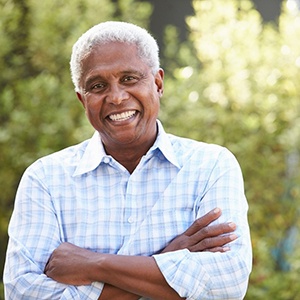 Smiling senior man with partial dentures in Belmont