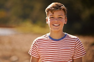 Young boy with healthy smile after children's dentistry