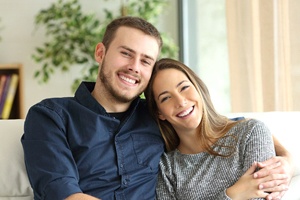 Young couple, happy they invested in a smile makeover