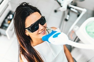 Woman receiving in office teeth whitening