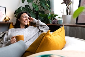 Woman relaxing at home after wisdom tooth removal