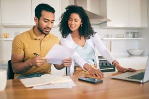 Young couple discussing their family budget